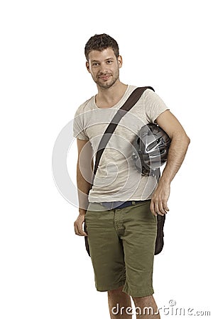 Young man holding helmet Stock Photo