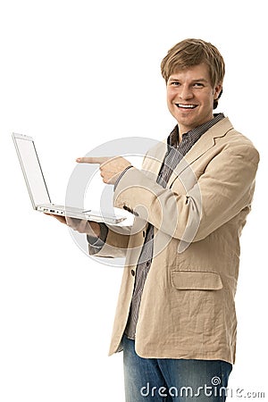 Young man holding laptop with blank screen Stock Photo