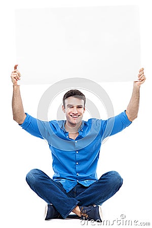 Young man holding poster above his head Stock Photo