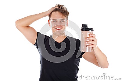 Young man holding a protein shake Stock Photo