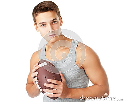 Young man holding rugby ball Stock Photo