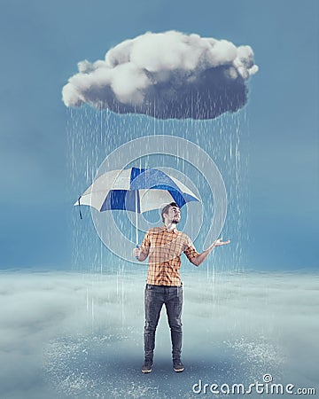 Young man holding an umbrella Stock Photo