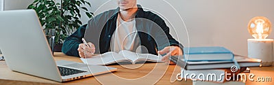 Young man at home while distance learning. Wide image Stock Photo