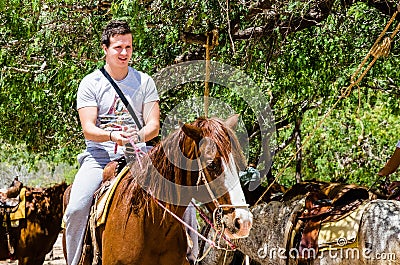 Young man horseback riding on the beach in Cabo san Lucas, Baja California Editorial Stock Photo