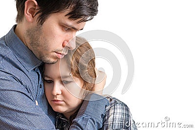 Young man is hugging his sad girlfriend. Consoling and compassion concept Stock Photo