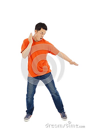 Young man imitate a karate expert with fight stance Stock Photo