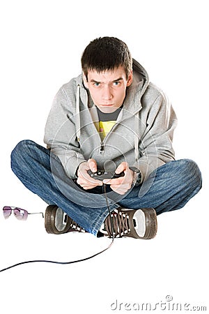 Young man with a joystick for game console. Isolated Stock Photo