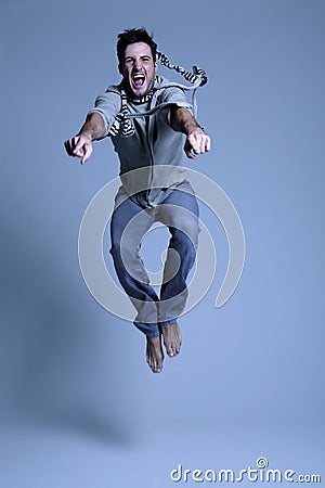 Young man jumping in excitement Stock Photo