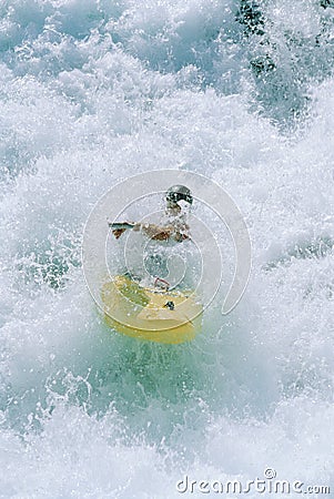 Young man kayaking in rapids Stock Photo