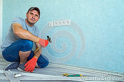 Young man laying floor and skirting looking at the camera. Stock Photo
