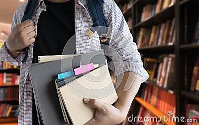 Young man In the library books high school library Stock Photo