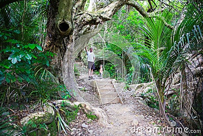 Young man with little daughter on hiking trail, Mount Manaia. Stock Photo