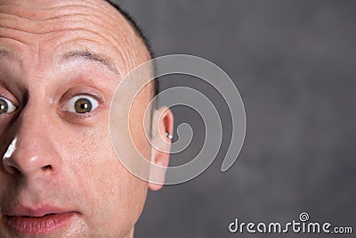 Young man looking amazed in to the camera Stock Photo