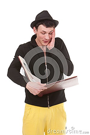 Young man looking in a large photograph album Stock Photo