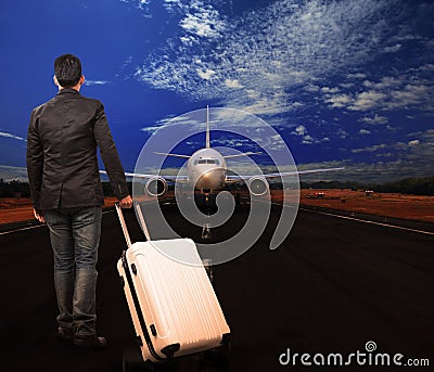 Young man and luggage on airport runways Stock Photo