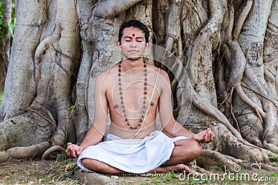 Young man meditating Stock Photo