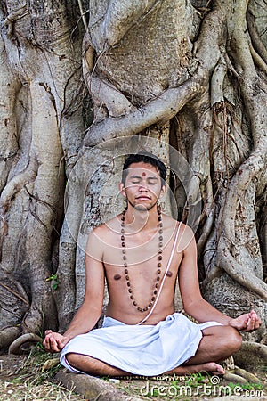 Young man meditating Stock Photo