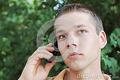 Young man on mobile phone Stock Photo