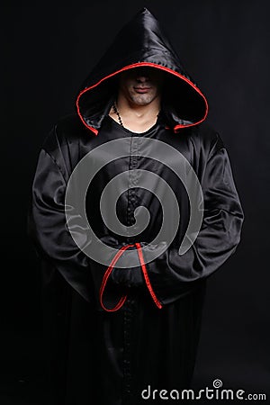 Young man in a monks robe Stock Photo