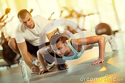 Young man motivating gym woman Stock Photo