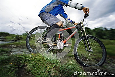 Young man mountain biking Stock Photo