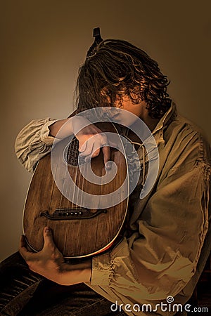 Young Man with Old Oud Guitar Lute Stock Photo