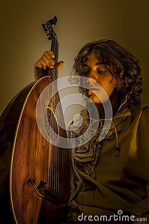 Young Man with Old Oud Guitar Lute Stock Photo