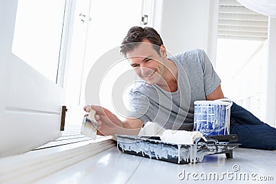 Young man painting home Stock Photo