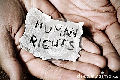 Young man with a paper with the text human rights Stock Photo