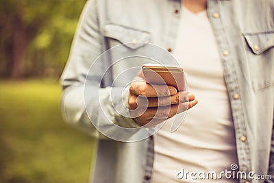 Phone in hand. Stock Photo