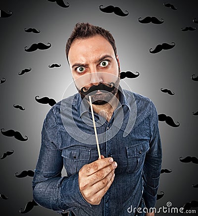 Young man with photo booth shaped mustache Stock Photo