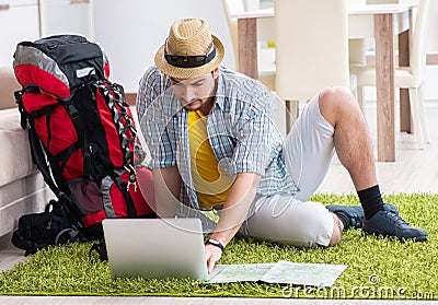 Young man planning his travel online Stock Photo