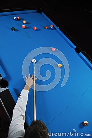 Young man play pro billiard game Stock Photo