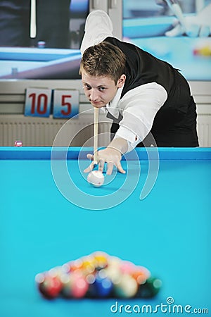 Young man play pro billiard game Stock Photo