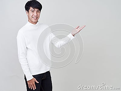 Young man pointed towards empty space for text Stock Photo