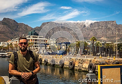 Young man posing in Cape Town. Bearded man with the table mountains as background Stock Photo