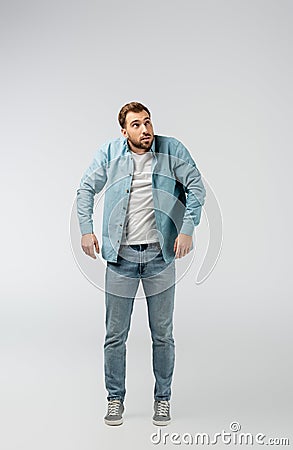 Young man posing like puppet isolated Stock Photo