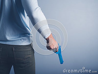 Young man posing with water pistol Stock Photo