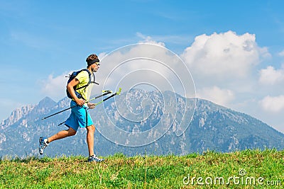 Young man practicing physical activity mountain and running with Stock Photo