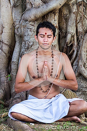 Young man prays Stock Photo