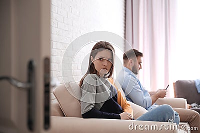 Young man preferring smartphone over his girlfriend. Relationship problems Stock Photo