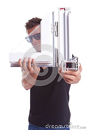 Young man presenting a pvc window sample Stock Photo