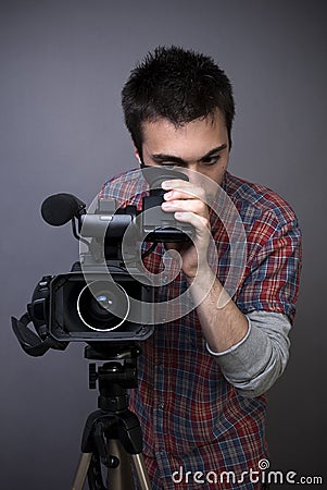 Young man with professional video camcorder Stock Photo