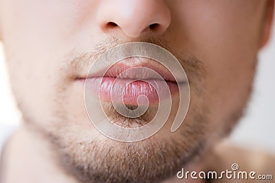 Young man with red lips and beard Stock Photo
