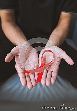 Young man with a red ribbon Stock Photo