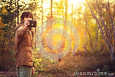 Young Man with retro photo camera outdoor hipster Lifestyle Stock Photo