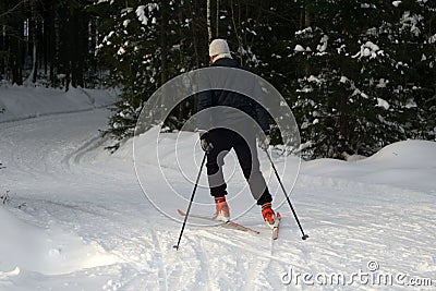 A young man rides cross-country skiing. Active winter. Active guests. Amateur sports. Editorial Stock Photo