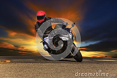 Young man riding big bike motorcycle on asphalt roads Stock Photo