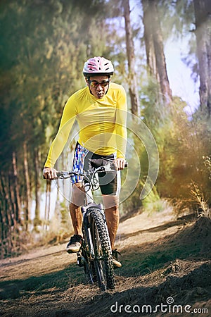 Young man riding mountain bike mtb in jungle track use for sport Stock Photo