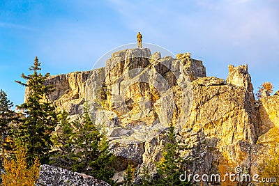 Young man on the rock of Raspberry Mountain Editorial Stock Photo